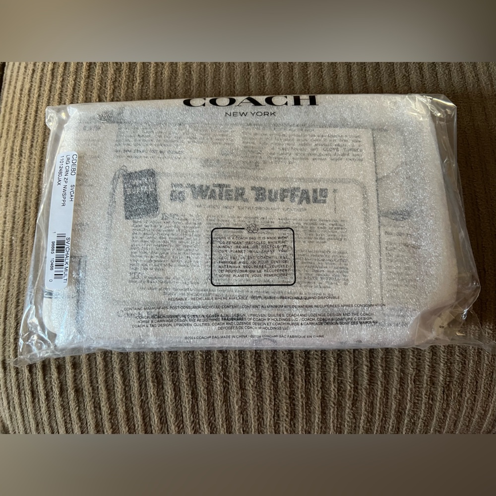 Coach Large Corner Zip Wristlet
With Newspaper Print NWT w/packaging - Picture 3 of 5